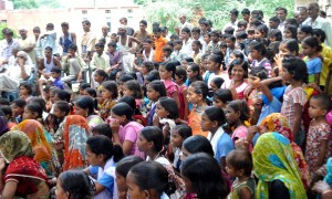 Women, children, and men watch a street play performance in their village on the theme of "stop female foeticide" in the Morena district, Madhya Pradesh, India. © 2011 Anil Gulati, Courtesy of Photoshare